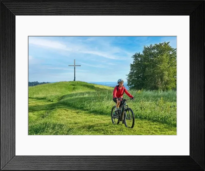 Framed Print : pretty senior woman riding her electric mountain bike in the Allgaeu mountains near Oberstaufen and Stiefenhofen Framed Print : pretty senior woman riding her electric mountain bike in the Allgaeu mountains near Oberstaufen and Stiefenhofen