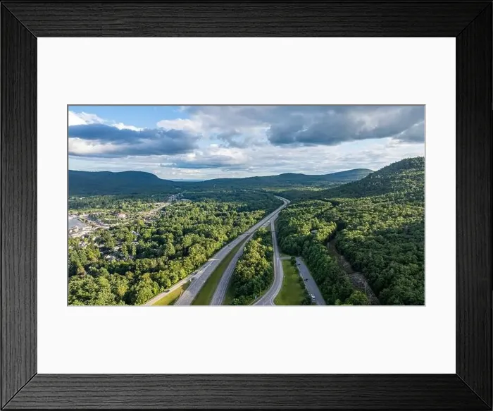 Framed Print : August 20 2024, Sunny afternoon summer aerial image of the interstate, I 87 north of Lake George, NY, USA Framed Print : August 20 2024, Sunny afternoon summer aerial image of the interstate, I 87 north of Lake George, NY, USA