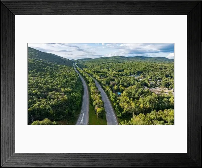 Framed Print : August 20 2024, Sunny afternoon summer aerial image of the interstate, I 87 north of Lake George, NY, USA Framed Print : August 20 2024, Sunny afternoon summer aerial image of the interstate, I 87 north of Lake George, NY, USA