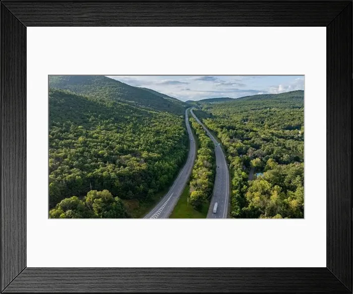 Framed Print : August 20 2024, Sunny afternoon summer aerial image of the interstate, I 87 north of Lake George, NY, USA Framed Print : August 20 2024, Sunny afternoon summer aerial image of the interstate, I 87 north of Lake George, NY, USA