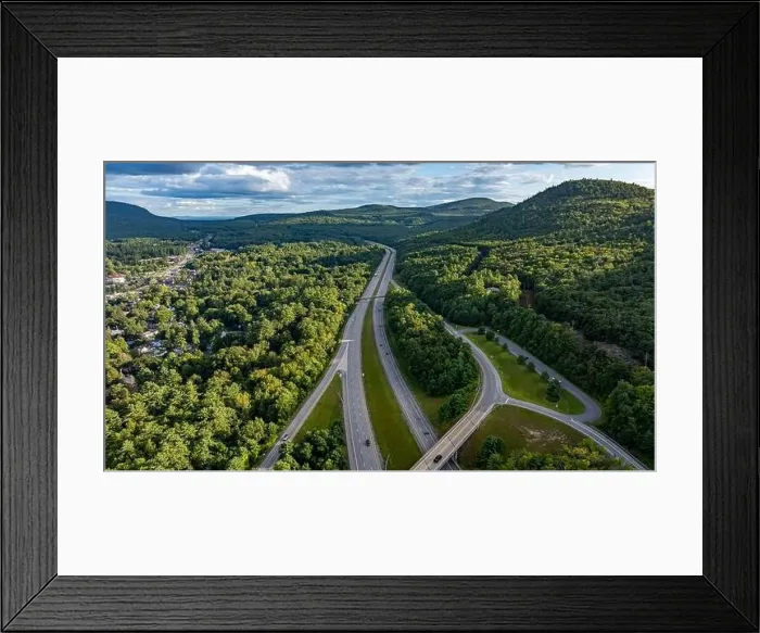 Framed Print : August 20 2024, Sunny afternoon summer aerial image of the interstate, I 87 north of Lake George, NY, USA Framed Print : August 20 2024, Sunny afternoon summer aerial image of the interstate, I 87 north of Lake George, NY, USA
