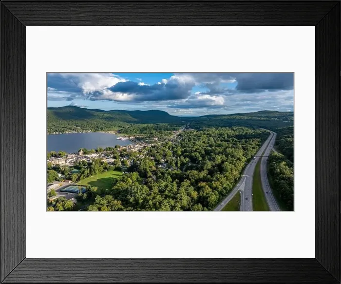 Framed Print : August 20 2024, Sunny afternoon summer aerial image of the interstate, I 87 north of Lake George, NY, USA Framed Print : August 20 2024, Sunny afternoon summer aerial image of the interstate, I 87 north of Lake George, NY, USA
