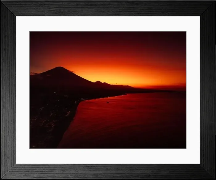 Framed Print : Coastline with sunset or sunrise and quiet ocean in Bali. Silhouette of coastline with Agung volcano Framed Print : Coastline with sunset or sunrise and quiet ocean in Bali. Silhouette of coastline with Agung volcano