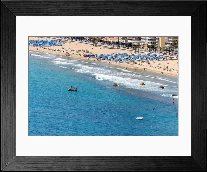 Framed Print : Photo of the city of Benidorm in Spain in the summer time showing people on the famous Levante Beach Framed Print : Photo of the city of Benidorm in Spain in the summer time showing people on the famous Levante Beach