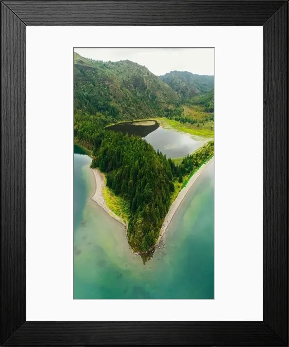 Framed Print : A stunning aerial photograph showcases a majestic lake surrounded by rich green forests in the Azores The serene water Framed Print : A stunning aerial photograph showcases a majestic lake surrounded by rich green forests in the Azores The serene water