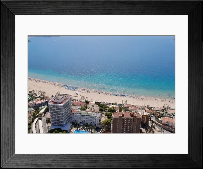 Framed Print : Aerial drone photo of the beautiful city of Benidorm in Spain showing the south beach Promenade and the hotels