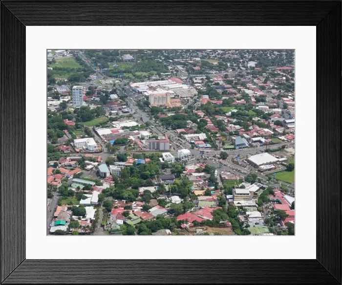 Framed Print : Managua, Nicaragua - August 16, 2024: Car traffic in Managua city aerial drone view Framed Print : Managua, Nicaragua - August 16, 2024: Car traffic in Managua city aerial drone view
