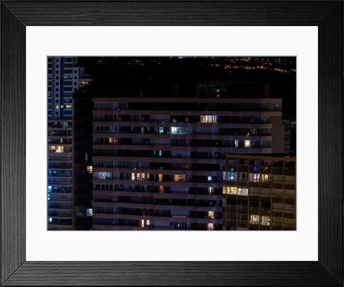 Framed Print : The Spanish town of Benidorm in Spain showing apartment building windows in the evening time showing lights on in Framed Print : The Spanish town of Benidorm in Spain showing apartment building windows in the evening time showing lights on in
