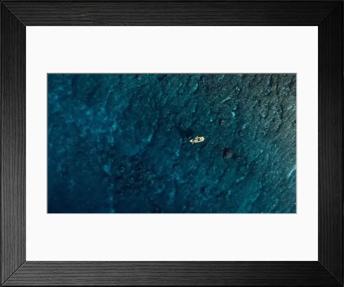 Framed Print : Kayaking on transparent kayak in blue ocean. Aerial view Framed Print : Kayaking on transparent kayak in blue ocean. Aerial view