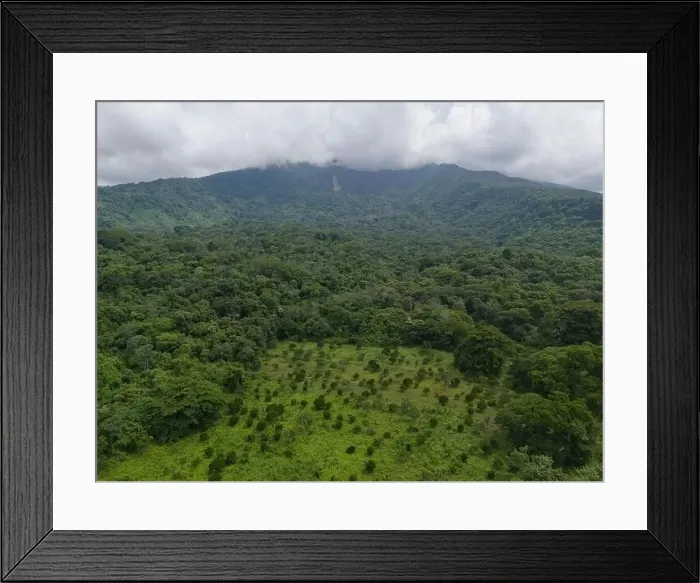 Framed Print : Big green mountain volcano with white clouds aerial drone view Framed Print : Big green mountain volcano with white clouds aerial drone view