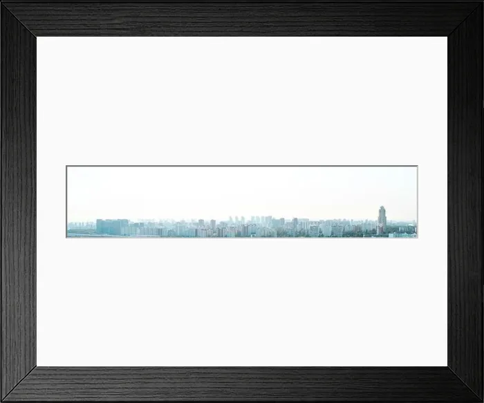 Framed Print : A big city at sunset, a panorama of multi-storey residential buildings Framed Print : A big city at sunset, a panorama of multi-storey residential buildings