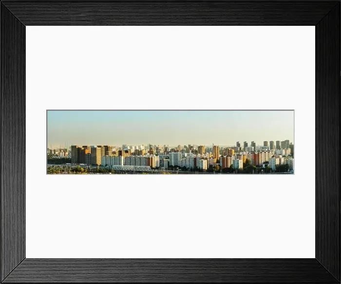 Framed Print : A big city at sunset, a panorama of multi-storey residential buildings Framed Print : A big city at sunset, a panorama of multi-storey residential buildings