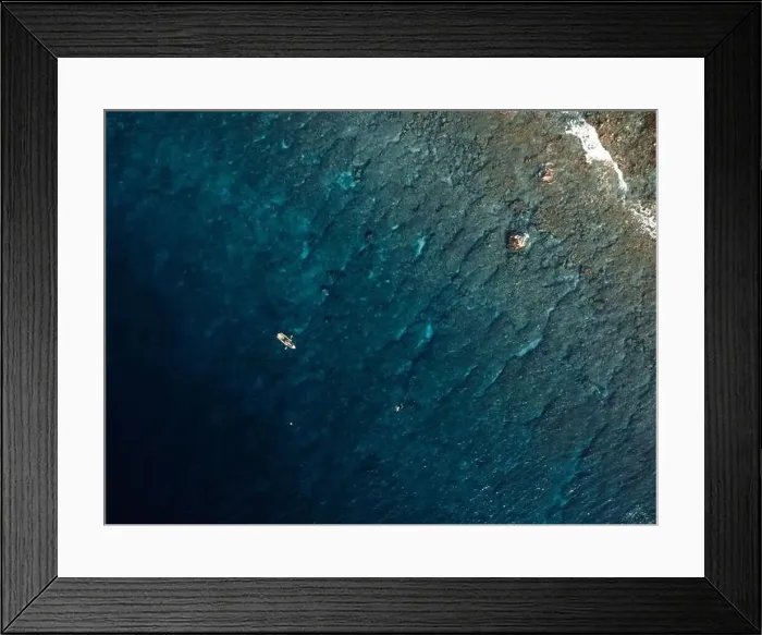 Framed Print : Kayaking on transparent kayak in tropical blue ocean. Aerial view, top down view Framed Print : Kayaking on transparent kayak in tropical blue ocean. Aerial view, top down view