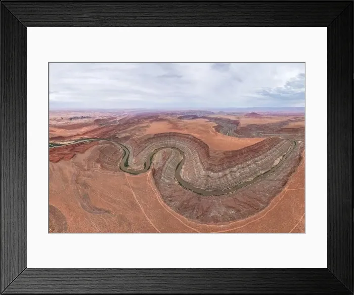 Framed Print : Drone view of twisting Rio San Juan as it carves through the layered red and orange strata of San Juan Canyon Framed Print : Drone view of twisting Rio San Juan as it carves through the layered red and orange strata of San Juan Canyon