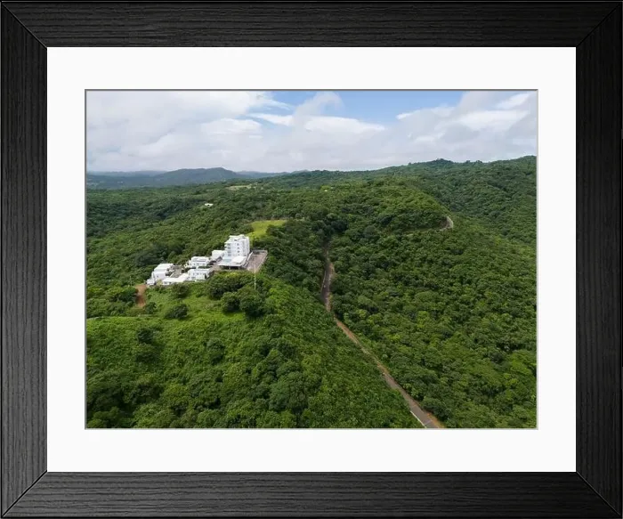 Framed Print : Residential building in jungle background aerial drone view Framed Print : Residential building in jungle background aerial drone view