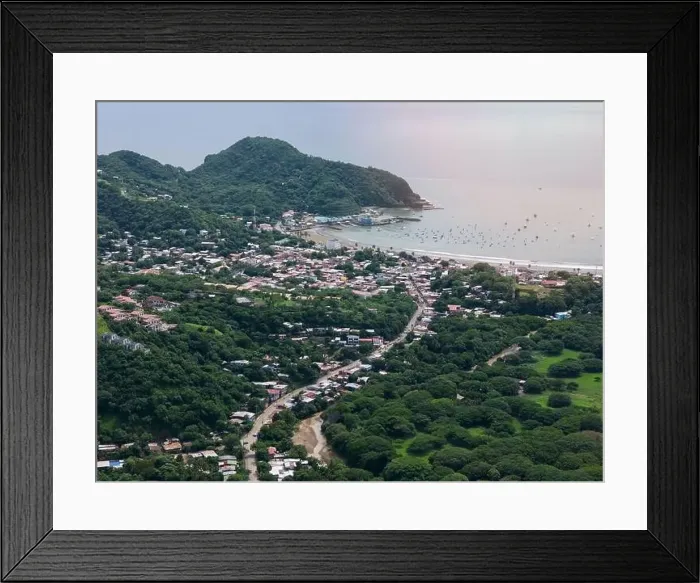 Framed Print : Houses on main street in San juan Del Sur town aerial drone view Framed Print : Houses on main street in San juan Del Sur town aerial drone view