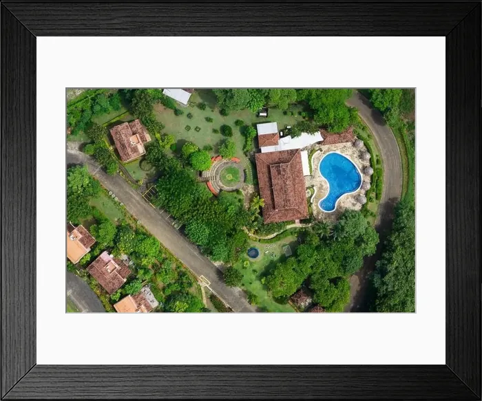 Framed Print : Villa patio with blue pool and green grass above top drone view Framed Print : Villa patio with blue pool and green grass above top drone view