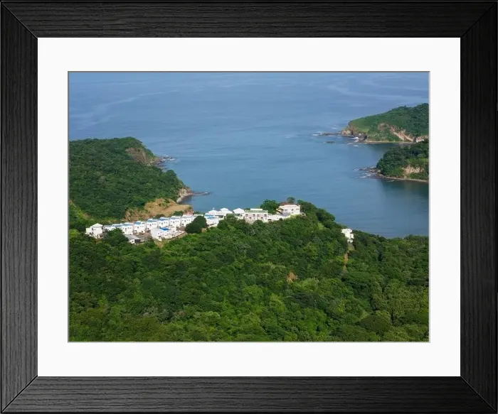 Framed Print : Residential on green hill beachfront aerial drone view Framed Print : Residential on green hill beachfront aerial drone view