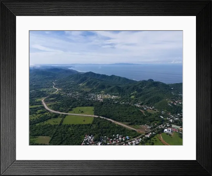 Framed Print : Green shore landscape at pacific ocean with highway road aerial drone view Framed Print : Green shore landscape at pacific ocean with highway road aerial drone view