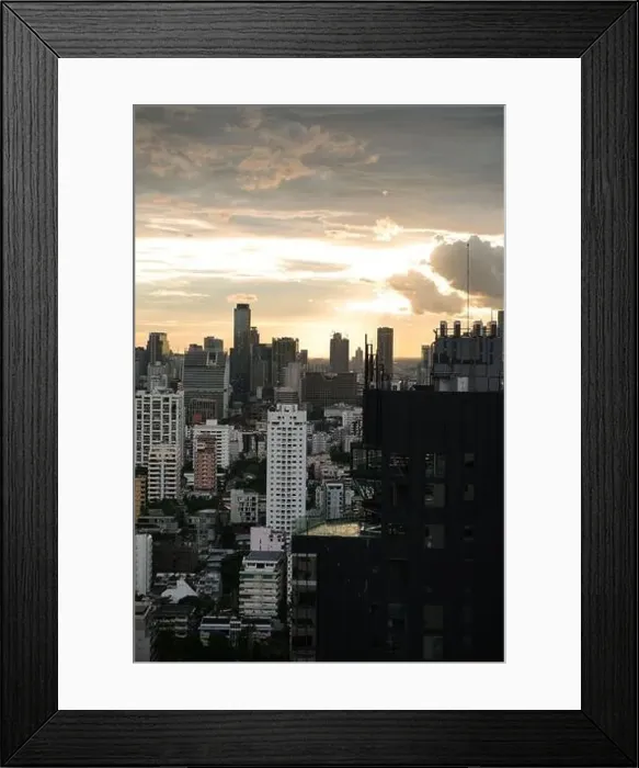Framed Print : View of the bangkok skyline at sunset from the Sukhumvit area on a sunny day, Thailand Framed Print : View of the bangkok skyline at sunset from the Sukhumvit area on a sunny day, Thailand