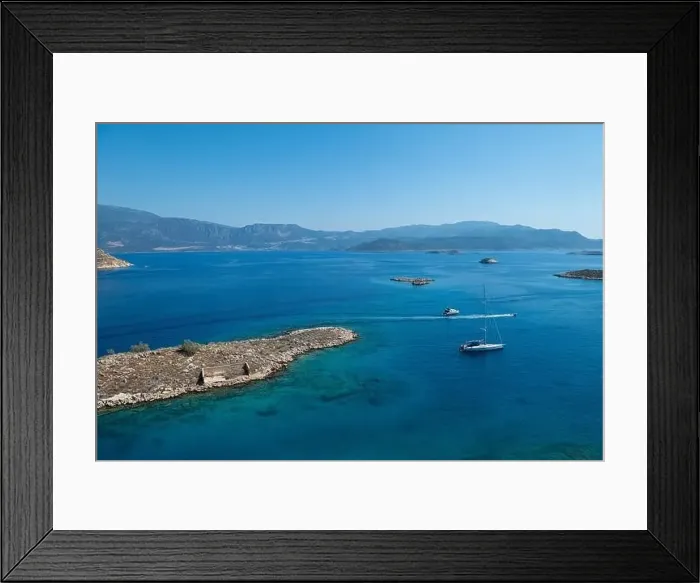 Framed Print : Clear, turquoise blue sea and small islands in the Aegean. The Greek island of Kastellorizo Framed Print : Clear, turquoise blue sea and small islands in the Aegean. The Greek island of Kastellorizo