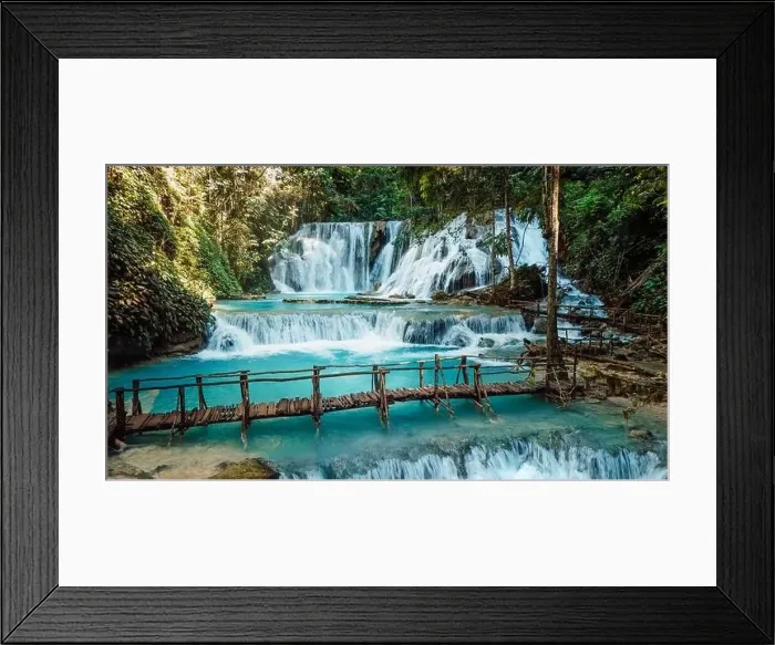 Framed Print : Scenic cascade waterfall with clear blue water and wooden bridge in Central Sulawesi, drone view Framed Print : Scenic cascade waterfall with clear blue water and wooden bridge in Central Sulawesi, drone view