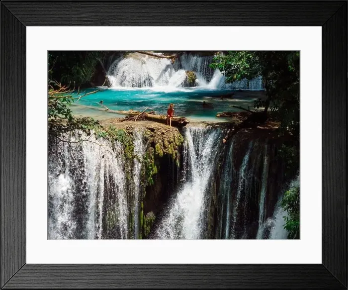 Framed Print : Woman on scenic cascade waterfall with clear blue water in Central Sulawesi, drone view Framed Print : Woman on scenic cascade waterfall with clear blue water in Central Sulawesi, drone view