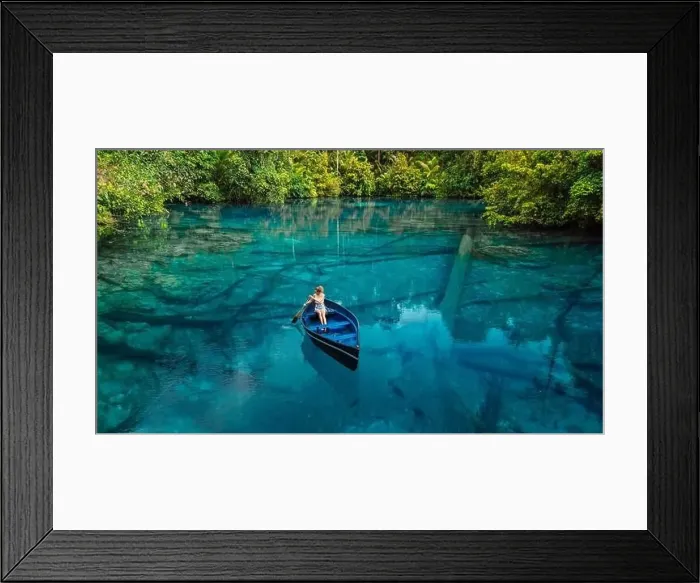 Framed Print : Woman on boat floating in tropical transparent lake with crystal blue fresh water in Sulawesi, Indonesia. Aerial view Framed Print : Woman on boat floating in tropical transparent lake with crystal blue fresh water in Sulawesi, Indonesia. Aerial view