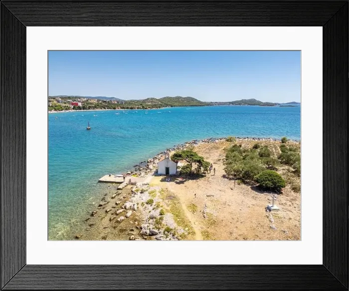 Framed Print : Pakostane, Croatia - July 27, 2024: Little island with little chapel near Pakostane city in Croatia Framed Print : Pakostane, Croatia - July 27, 2024: Little island with little chapel near Pakostane city in Croatia
