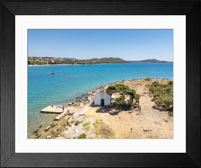 Framed Print : Pakostane, Croatia - July 27, 2024: Little island with little chapel near Pakostane city in Croatia Framed Print : Pakostane, Croatia - July 27, 2024: Little island with little chapel near Pakostane city in Croatia