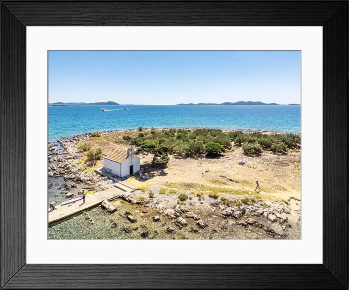 Framed Print : Pakostane, Croatia - July 27, 2024: Little island with little chapel near Pakostane city in Croatia