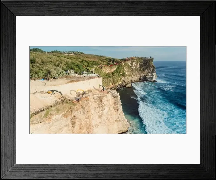 Framed Print : Escalators working and the destroying of the cliff in Uluwatu, Bali. Aerial view Framed Print : Escalators working and the destroying of the cliff in Uluwatu, Bali. Aerial view