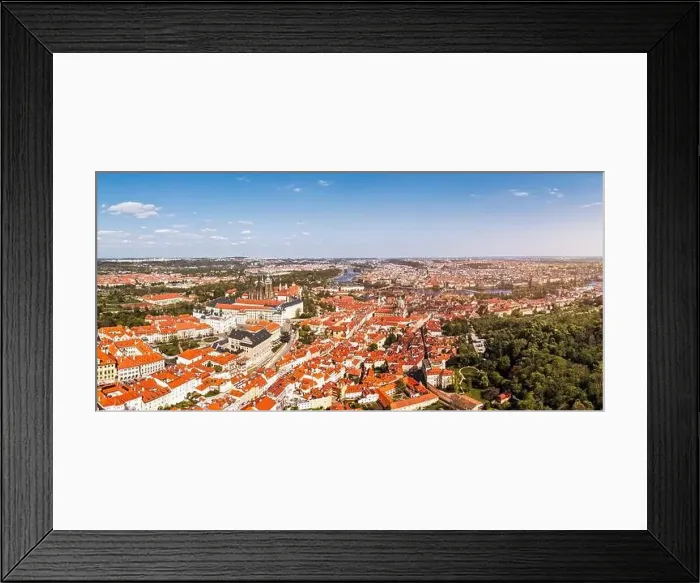 Framed Print : Panoramic view of Prague featuring historic buildings and vibrant rooftops on a sunny day in summer Framed Print : Panoramic view of Prague featuring historic buildings and vibrant rooftops on a sunny day in summer
