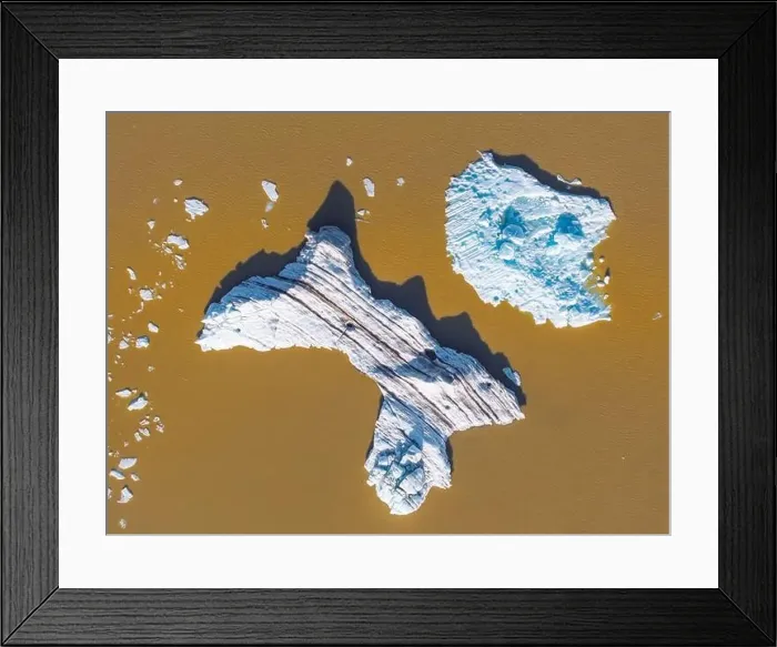 Framed Print : Aerial view taken by drone of iceberg in Fjallsjokull Glacier Lagoon during a summer day, Iceland, Polar Regions Framed Print : Aerial view taken by drone of iceberg in Fjallsjokull Glacier Lagoon during a summer day, Iceland, Polar Regions