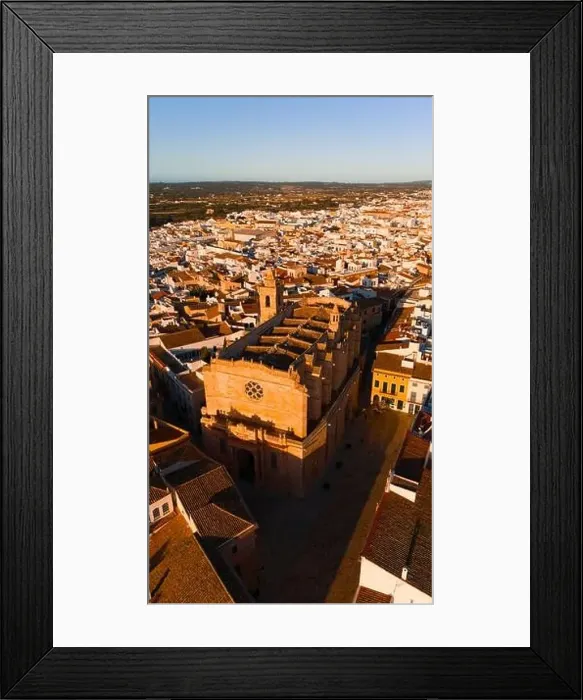 Framed Print : A drone captures the golden hues of sunset over the Ciutadella Cathedral located in Menorca Framed Print : A drone captures the golden hues of sunset over the Ciutadella Cathedral located in Menorca