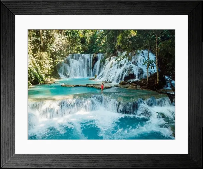 Framed Print : Woman walking on scenic cascade waterfalls with blue water in Central Sulawesi, drone view Framed Print : Woman walking on scenic cascade waterfalls with blue water in Central Sulawesi, drone view