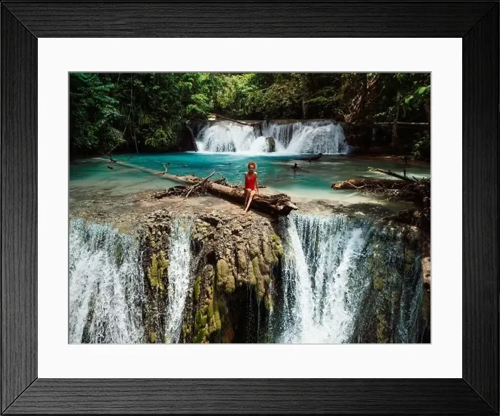 Framed Print : Woman on scenic cascade waterfall in Central Sulawesi, drone view Framed Print : Woman on scenic cascade waterfall in Central Sulawesi, drone view