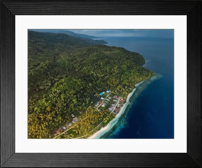 Framed Print : Coastline with mountains, ocean and cloudy weather on scenic island in Indonesia. Travel destination concept Framed Print : Coastline with mountains, ocean and cloudy weather on scenic island in Indonesia. Travel destination concept