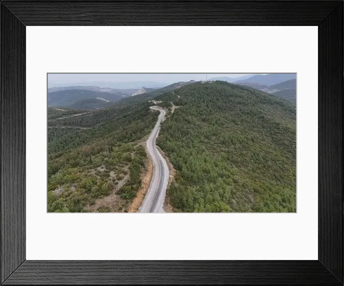 Framed Print : Vertical aerial photo overcast weather, asphalt road over the mountain peak covered by pine tree forest Framed Print : Vertical aerial photo overcast weather, asphalt road over the mountain peak covered by pine tree forest