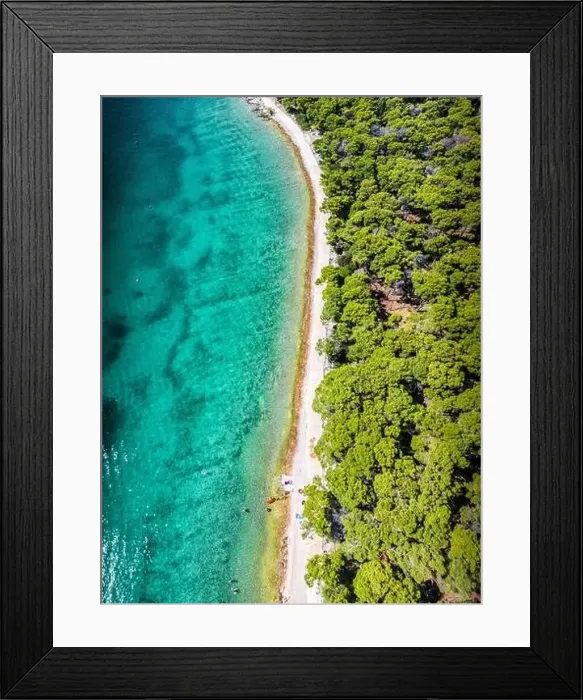 Framed Print : Top down view of beautiful white beach and green pine forest of Rogoznica, Croatia during summer Framed Print : Top down view of beautiful white beach and green pine forest of Rogoznica, Croatia during summer