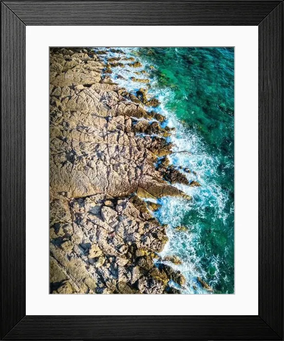 Framed Print : Aerial view of waves splashing the Punta Planka shore, with sharp rocks Framed Print : Aerial view of waves splashing the Punta Planka shore, with sharp rocks