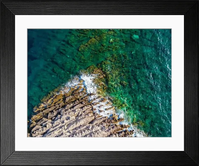 Framed Print : Aerial view of sharp rocks on Punta Planka, Croatia, splashed with waves creating white foam Framed Print : Aerial view of sharp rocks on Punta Planka, Croatia, splashed with waves creating white foam