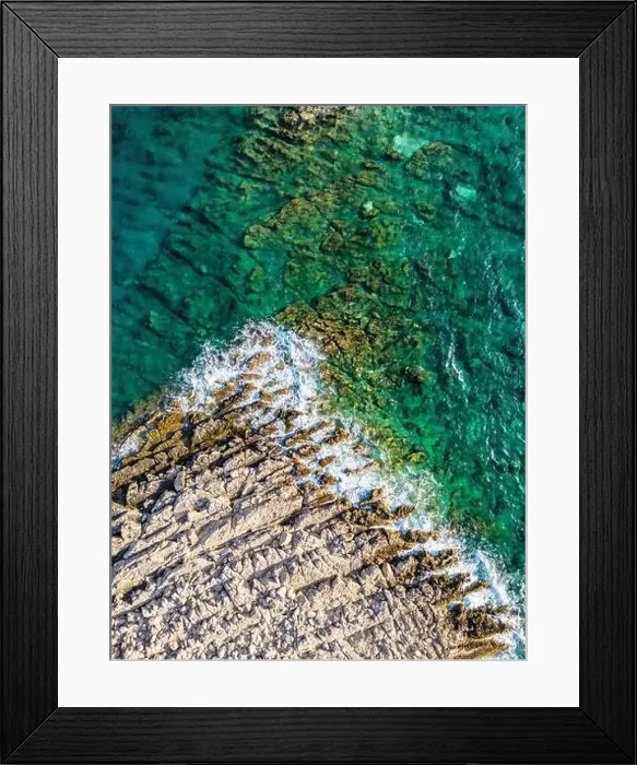 Framed Print : Aerial view of sharp rocks on Punta Planka, Croatia, splashed with waves creating white foam Framed Print : Aerial view of sharp rocks on Punta Planka, Croatia, splashed with waves creating white foam