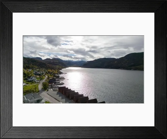 Framed Print : A scenic view of a tranquil Norwegian fjord surrounded by mountains and greenery Framed Print : A scenic view of a tranquil Norwegian fjord surrounded by mountains and greenery