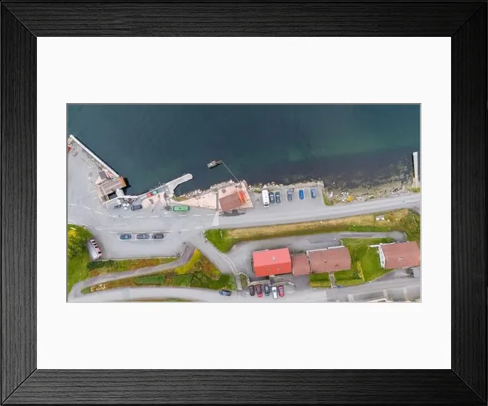 Framed Print : Aerial view of a small coastal village featuring a harbor Framed Print : Aerial view of a small coastal village featuring a harbor