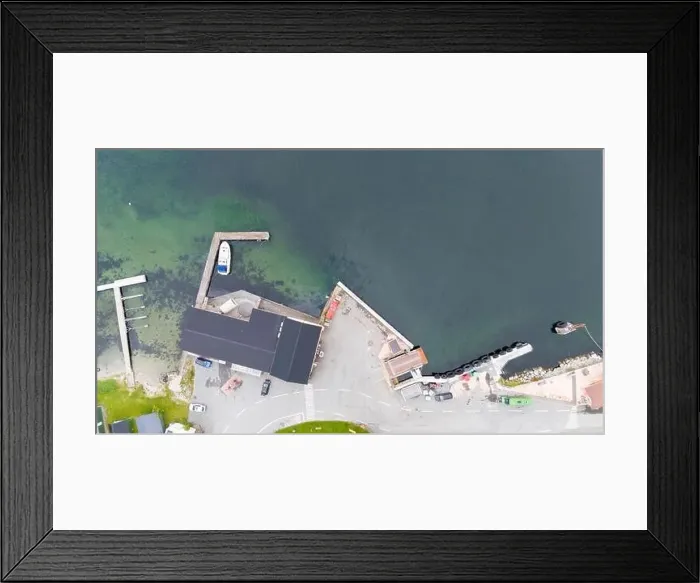 Framed Print : Aerial view of a small coastal village featuring a harbor Framed Print : Aerial view of a small coastal village featuring a harbor