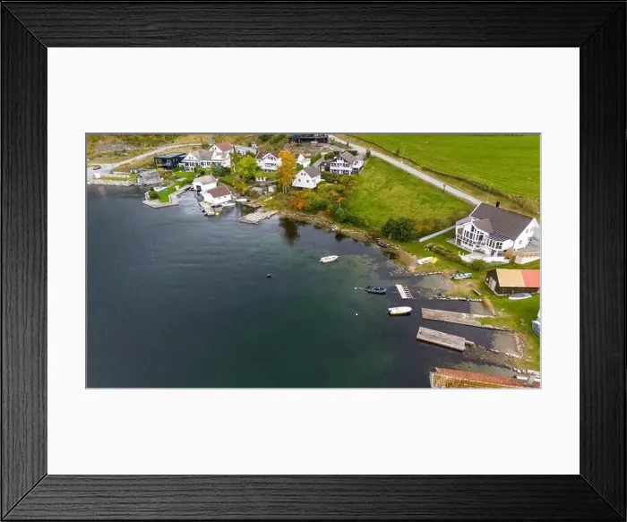 Framed Print : Aerial view of a small coastal village featuring a harbor Framed Print : Aerial view of a small coastal village featuring a harbor