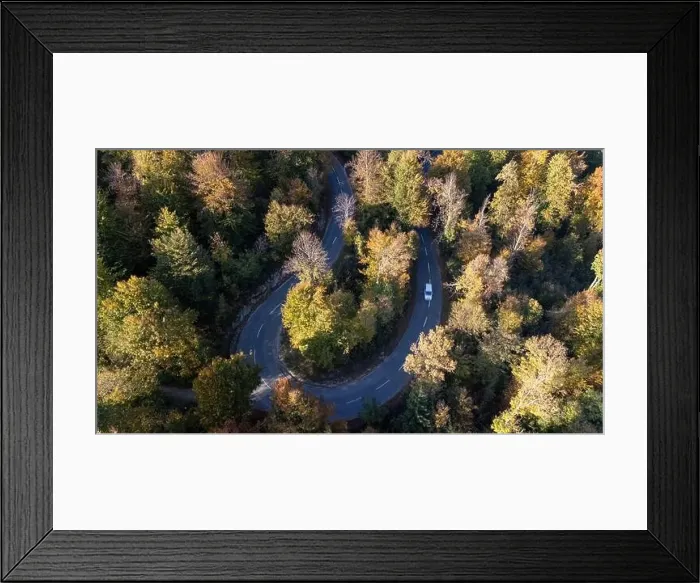 Framed Print : Mountain road surrounded by fall season forest. Aerial photography Framed Print : Mountain road surrounded by fall season forest. Aerial photography
