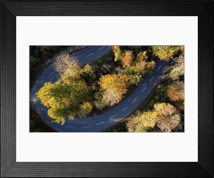 Framed Print : Mountain road surrounded by fall season forest. Aerial photography Framed Print : Mountain road surrounded by fall season forest. Aerial photography