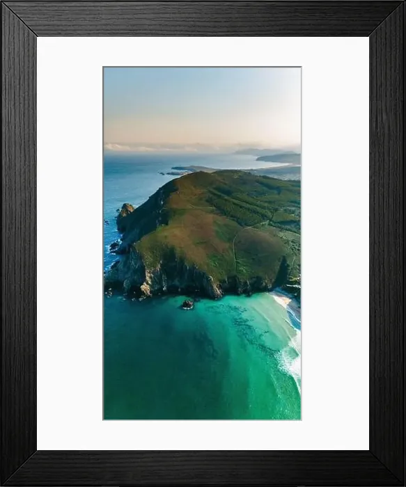 Framed Print : Captivating drone shot capturing the serene beauty of a green peninsula surrounded by turquoise waters in Galicia Framed Print : Captivating drone shot capturing the serene beauty of a green peninsula surrounded by turquoise waters in Galicia